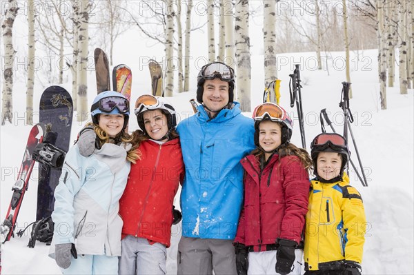 Portrait of smiling Caucasian family on skiing vacation