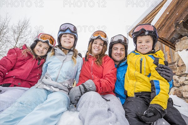 Portrait of smiling Caucasian family on winter vacation