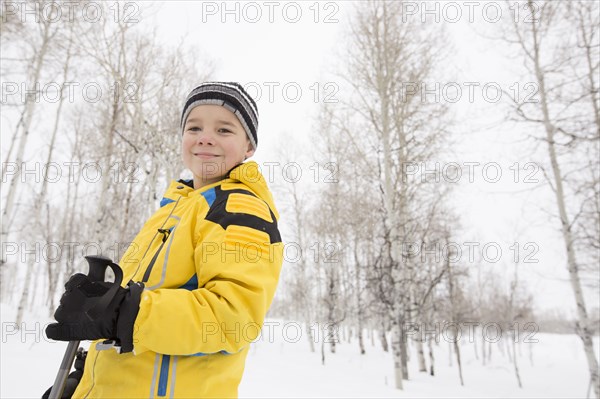 Portrait of smiling Caucasian boy in winter