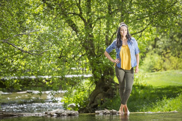 Coffin Caucasian woman standing near river