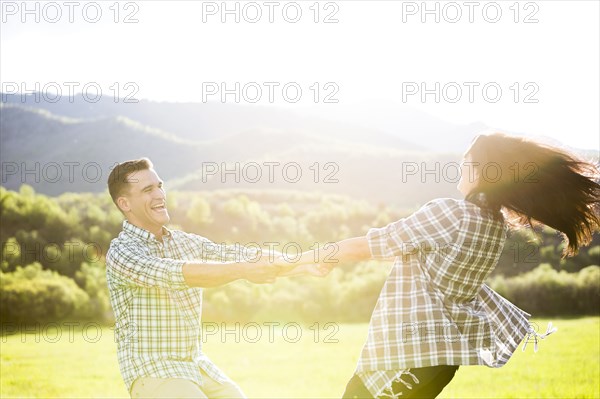 Couple dancing in park