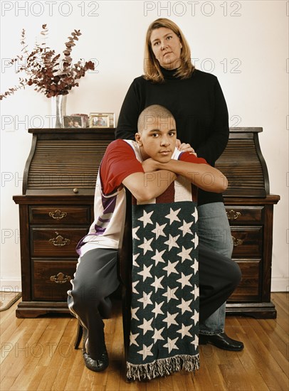 Mother and son posing with American flag blanket