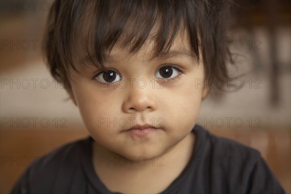 Serious mixed race boy