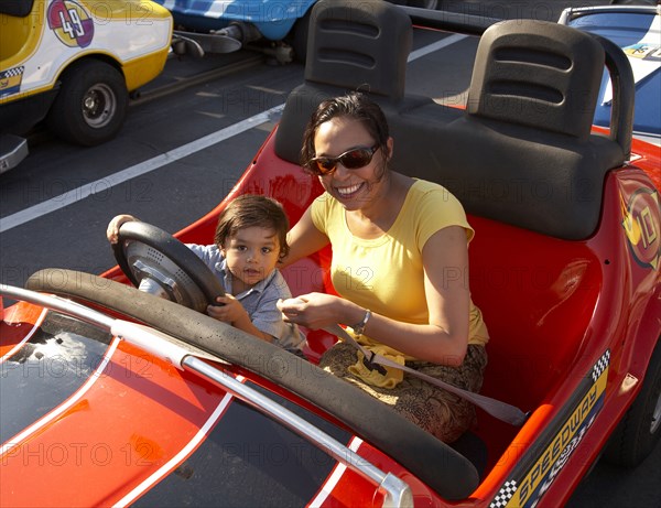 Mother and son in bumper car