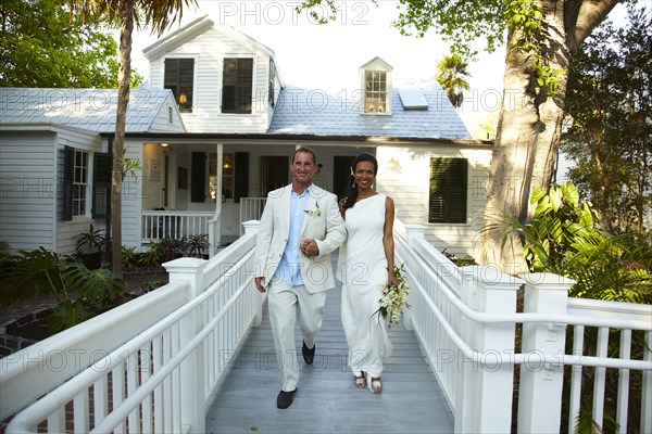 Bride and groom walking together after wedding