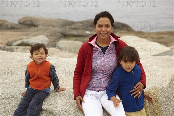 Mother and boys enjoying the beach