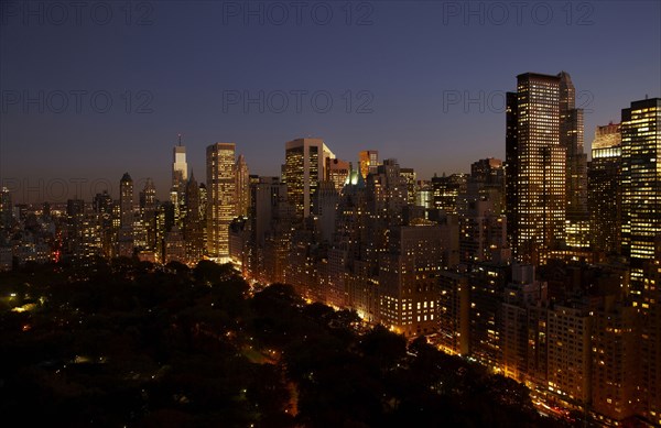 Sunset and illuminated cityscape