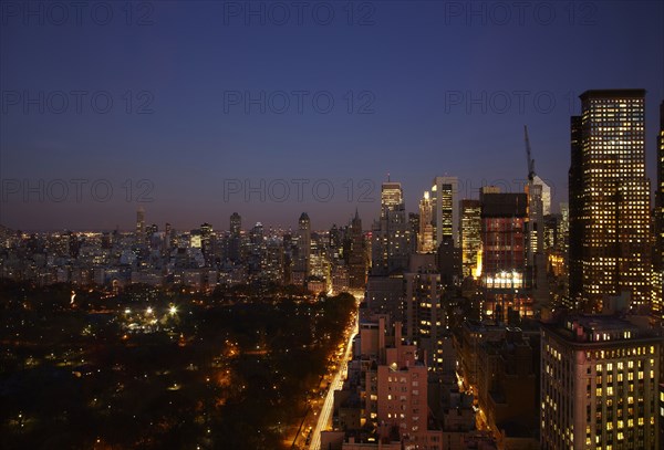 Sunset and illuminated cityscape