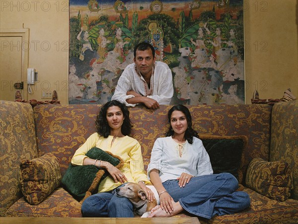 Family smiling together in living room