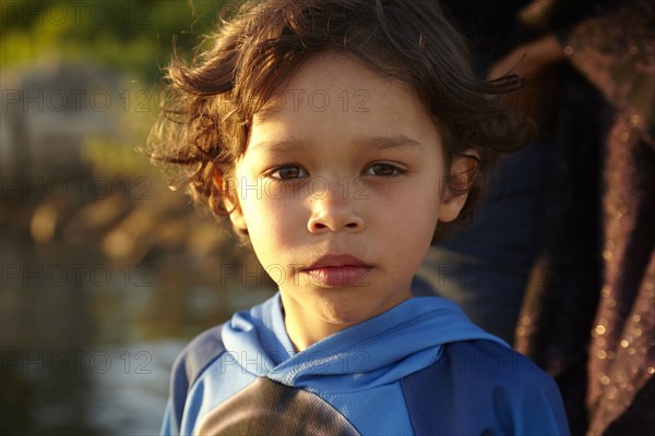 Mixed race boy with serious expression