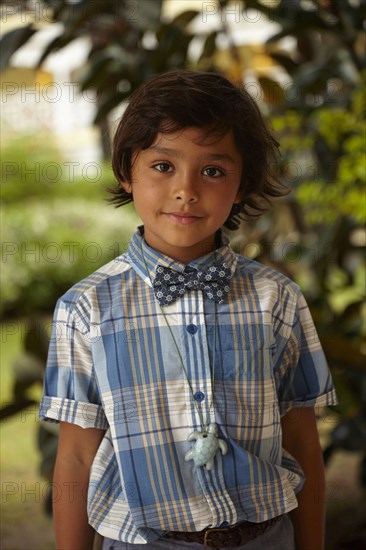 Mixed race boy smiling outdoors