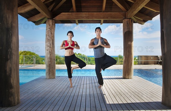 Couple practicing yoga together