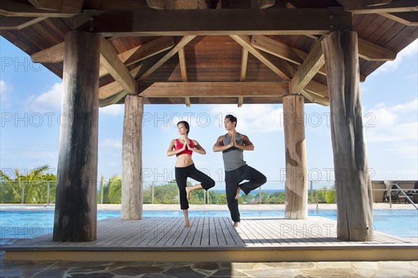 Couple practicing yoga together