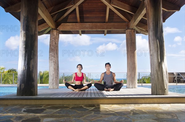 Couple practicing yoga together