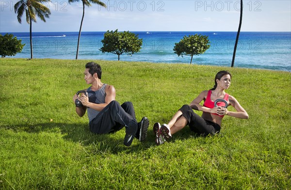 Couple exercising together at waterfront