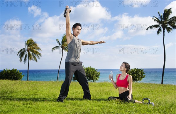 Couple exercising together at waterfront