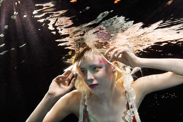 Glamorous Caucasian woman under water