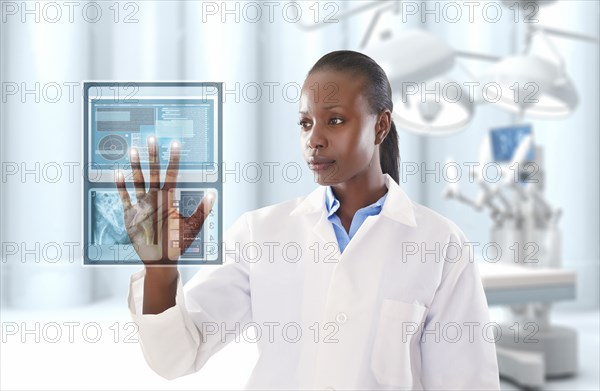 African American doctor looking at digital display in doctor's office