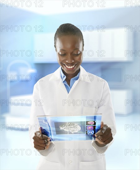 African American doctor using digital tablet in doctor's office