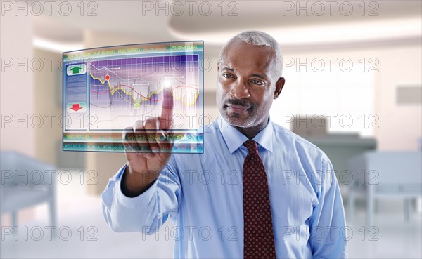 Black businessman using digital display