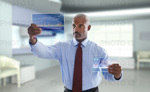 Black businessman using digital display
