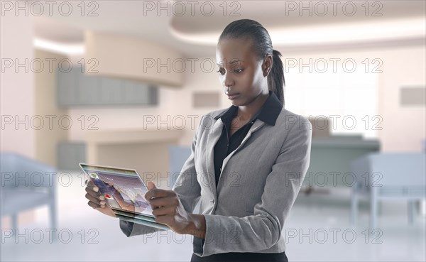 African American businesswoman using digital display