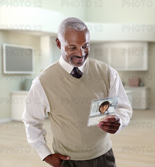 Black businessman using digital tablet in office