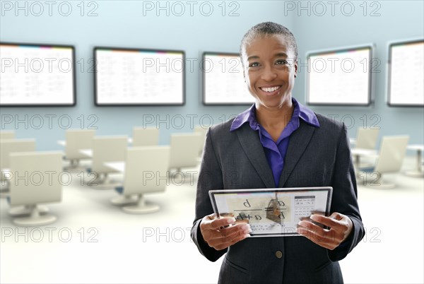 Black businesswoman using digital tablet in conference room