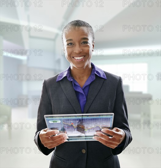 Black businesswoman using digital tablet in office