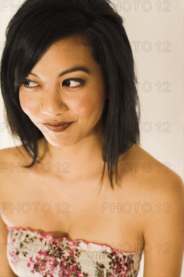 Asian woman looking sideways