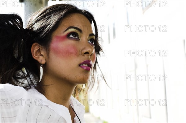 Young Asian woman wearing dramatic makeup