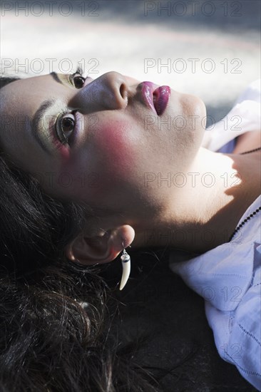 Young Asian woman wearing dramatic makeup