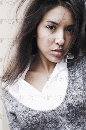 Middle Eastern woman with hair blowing