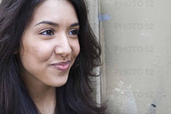 Middle Eastern woman smirking