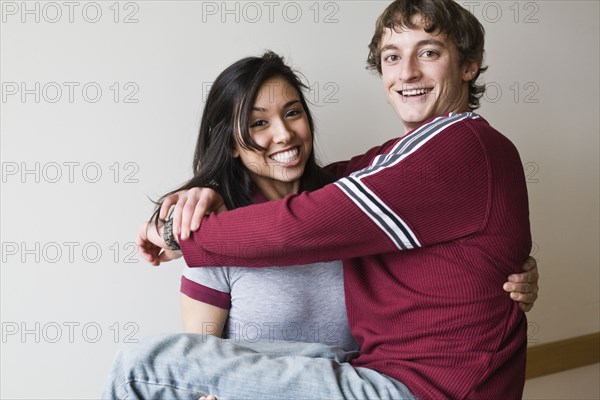 Middle Eastern woman holding boyfriend