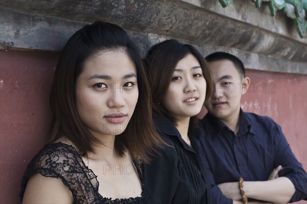 Chinese friends sitting outdoors