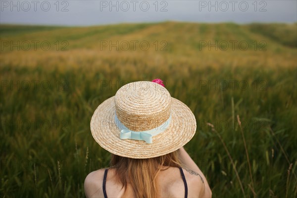Caucasian woman in field of tall grass