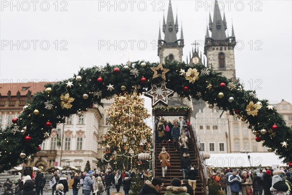 Crowd near Christmas decorations outdoors