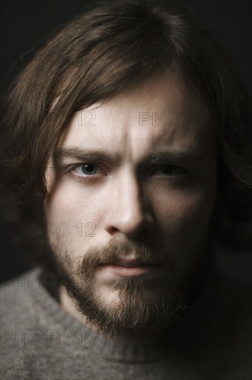 Close up of serious Caucasian man with beard