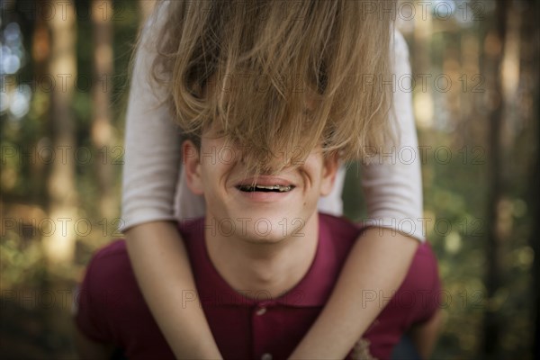 Hair of woman covering face of man