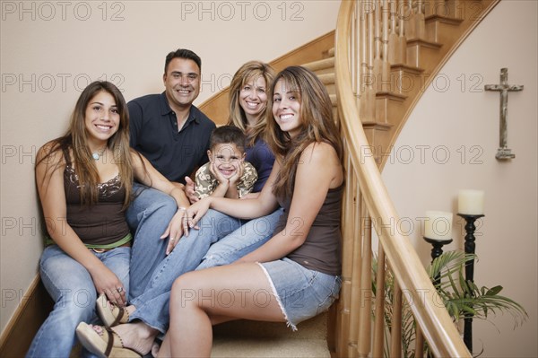 Family smiling for the camera together