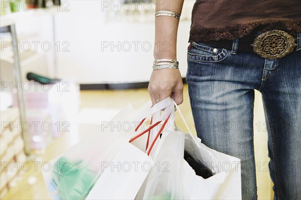 Young woman carrying shopping bags
