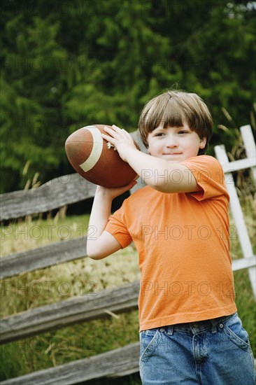 Boy throwing football