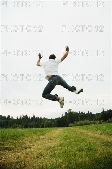 Man jumping in field