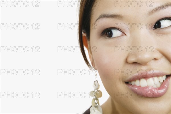 Close up of Asian woman biting lip