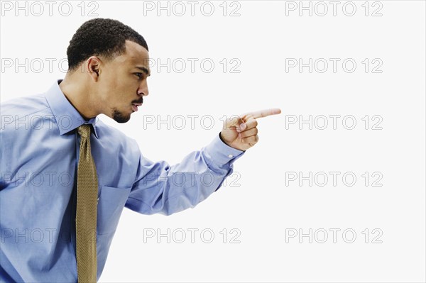 Portrait of African businessman pointing