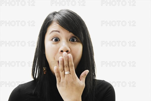 Portrait of Asian woman looking surprised