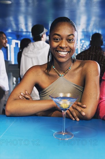 Portrait of African woman with cocktail