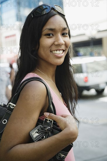 African woman carrying purse
