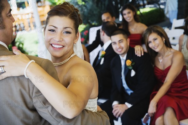 Hispanic bride dancing with father